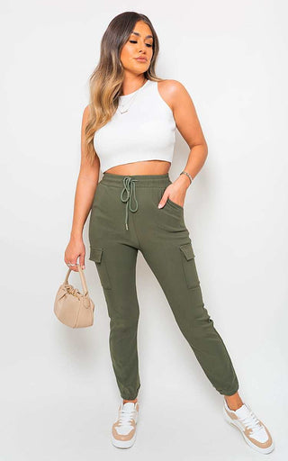 Cargo Pocket Trouser in green with drawstring and side pockets, styled with a white crop top and casual sneakers.