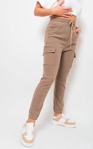 Cargo Pocket Trouser in brown with drawstring detail and side pockets, styled for urban and outdoor wear.