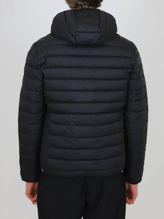 Back view of black Winter Steep Padded Jacket with hood and horizontal quilting on person