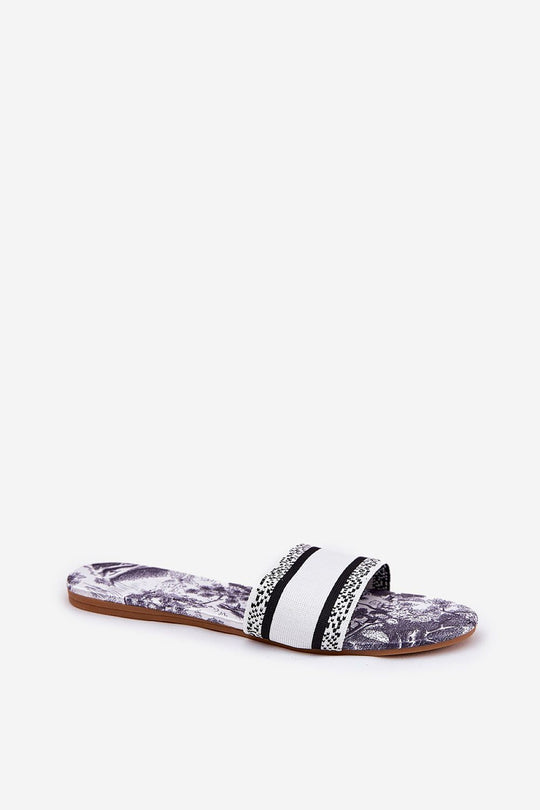 Flat women’s flip-flops with distinctive pattern and fabric footbed.