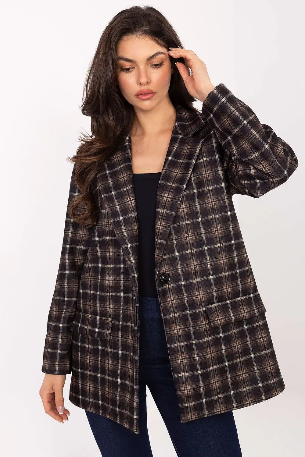 Women’s checked blazer in classic pattern with shoulder pads, buttoned up, styled for casual and elegant looks