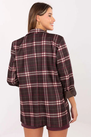 Back view of woman wearing a stylish women’s checked blazer with classic checkered pattern and long sleeves