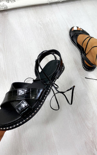 Deja Strappy Sandals in black with chic design and premium materials.