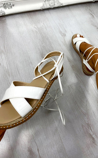 Deja Strappy Sandals in white, showcasing chic design and premium materials for stylish summer wear.