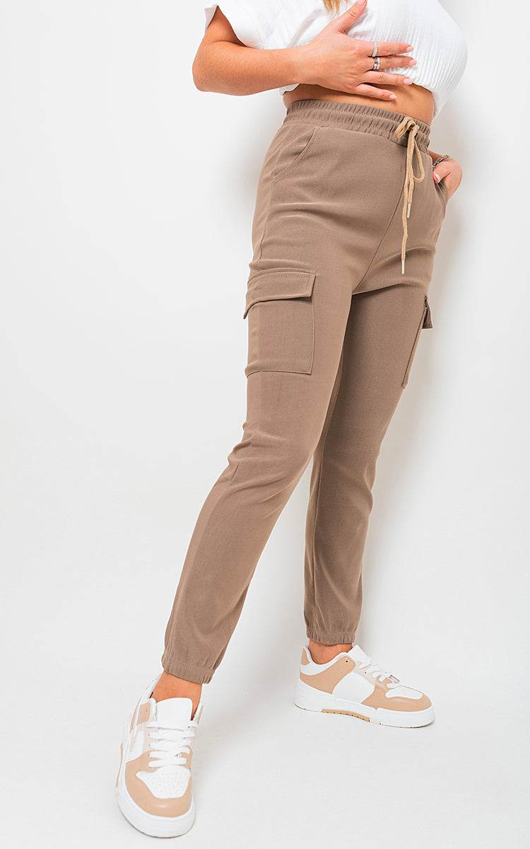 Cargo Pocket Trouser in brown with drawstring detail and side pockets, styled for urban and outdoor wear.