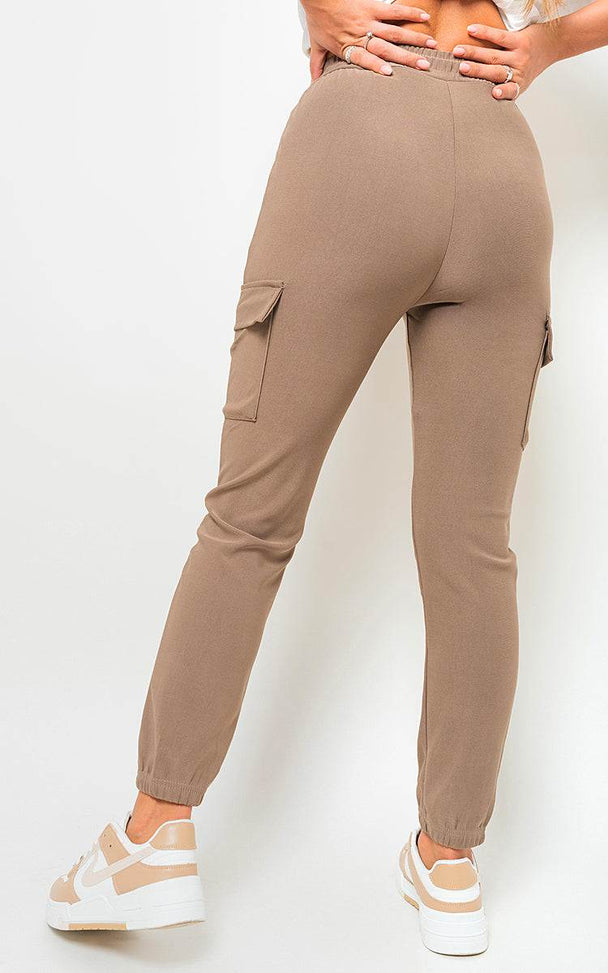 Cargo Pocket Trouser with drawstring and utilitarian design, featuring side pockets and durable polyester fabric.