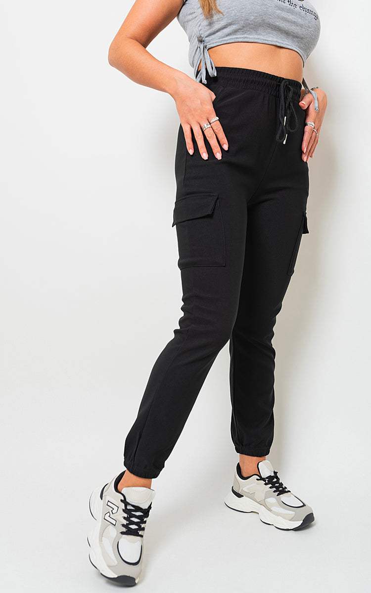 Cargo Pocket Trouser with utilitarian design and drawstring waist, featuring ample cargo-style pockets for storage.